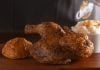 Church’s Bourbon Black Pepper Smokehouse Chicken is Back Church's Bourbon Black Pepper Smokehouse Chicken with a side and a biscuit