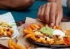 Taco Bell Selling New 7-Layer Nacho Fries And New 7-Layer Nacho Fries Burrito At Select Locations In Orlando, FL Taco Bell Selling New 7-Layer Nacho Fries And New 7-Layer Nacho Fries Burrito At Select Locations In Orlando, FL
